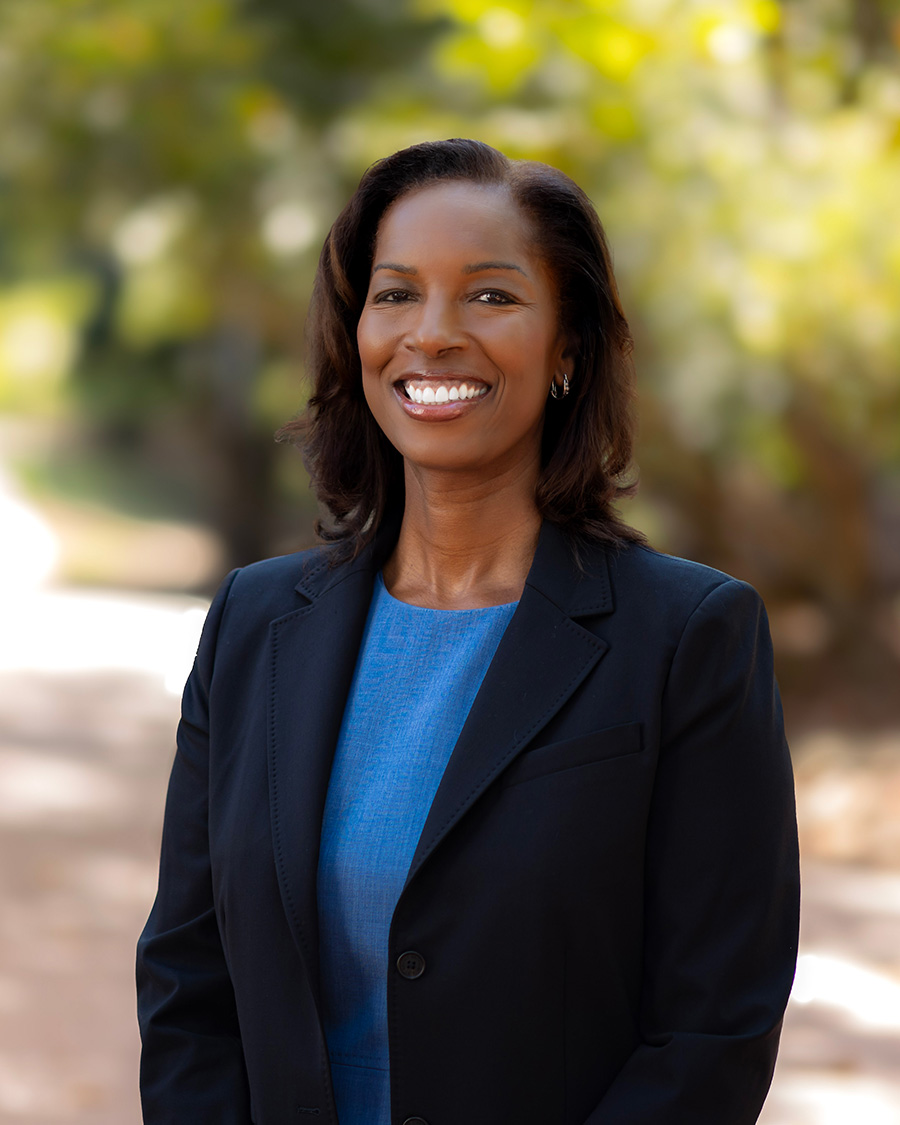 portrait of Badia Ahad standing outside and smiling