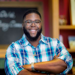 Picture of author and Harvard professor Anthony Jack standing with arms crossed